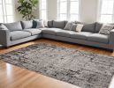 9' X 13' Ivory Grey Machine Woven Abstract Indoor Area Rug