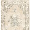 7' X 9' Beige And Ivory Center Jewel Area Rug