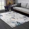 5' X 8' Blue And Ivory Abstract Strokes Area Rug